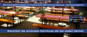 Standard-Bierzeltgarnituren mit rot-weiß kariertem Tischläufer und Tisch-Deko unterm Sonnenschirmen.